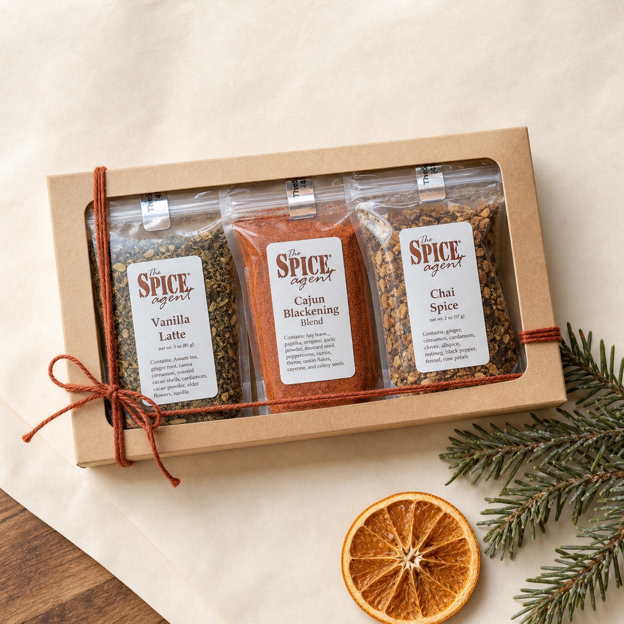 Three Spice Agent pouches in a compact kraft stocking stuffer sleeve