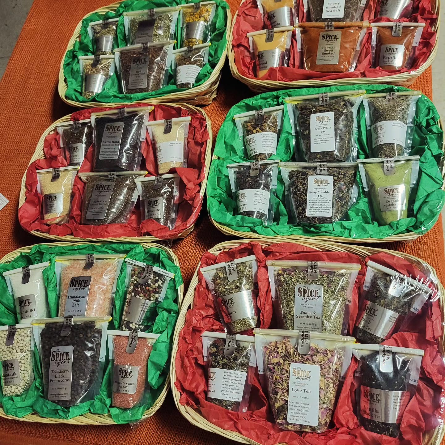 Gift baskets filled with Spice Agent teas, salts, peppercorns, and blends