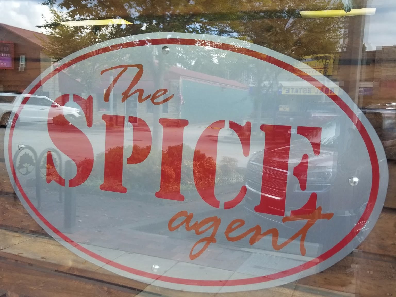 The Spice Agent storefront window sign on Commercial Street in Branson